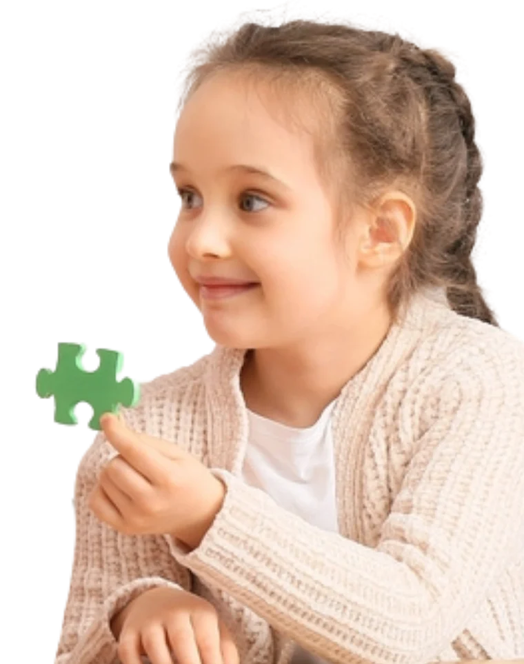 young autistic girl with a puzzle