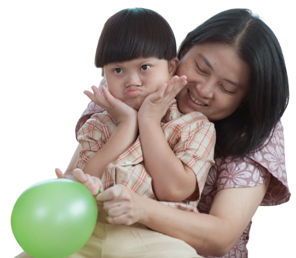 women holding down syndrome son and balloon